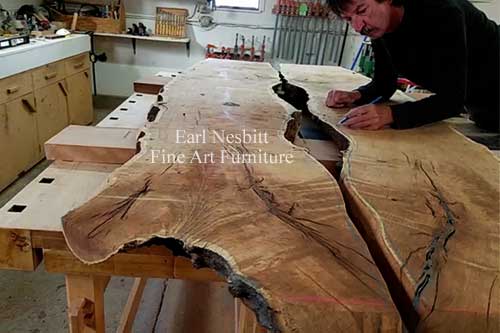 Earl marking notch on mesquite slabs for custom made live edge dining table